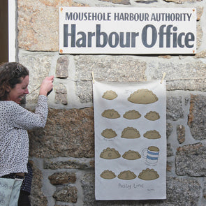 harbour office with pasty tea towel, mousehole holiday guide, cornish pasty recipie