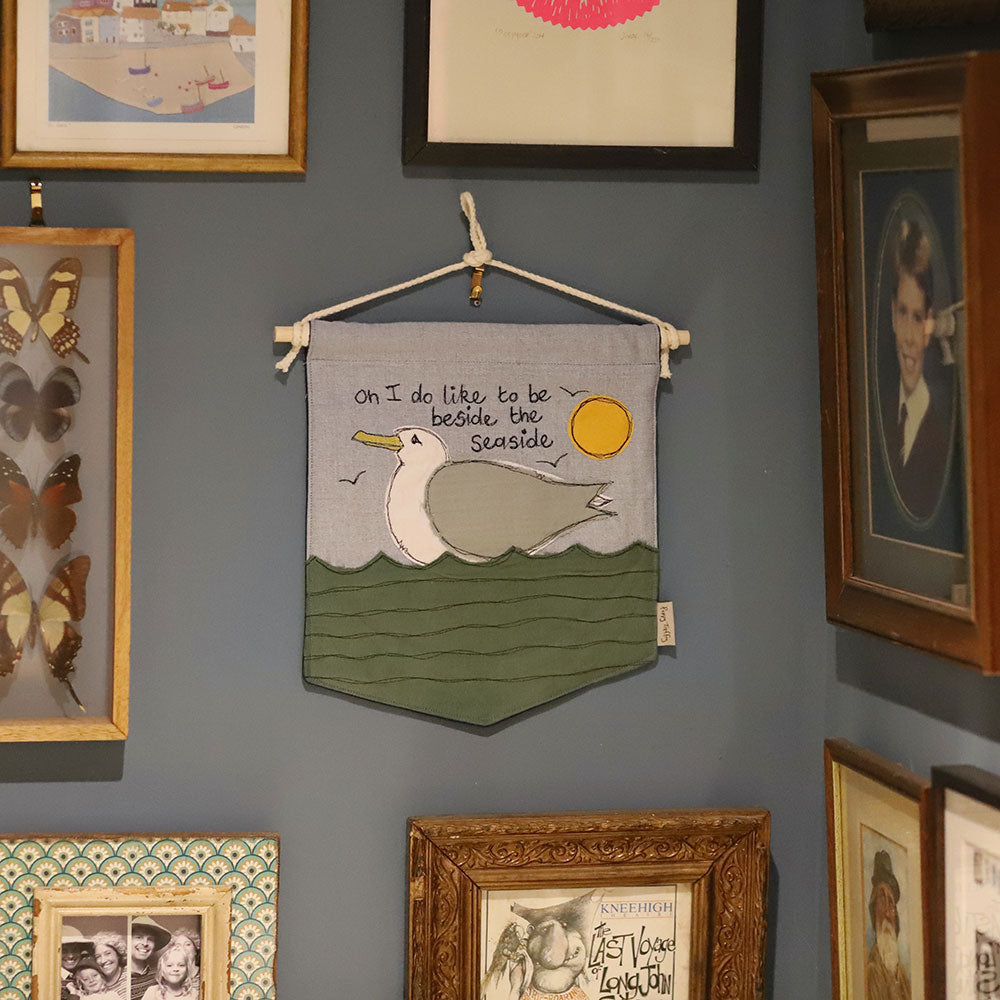 'I do like to be beside the seaside' embroidered Wall Hanging