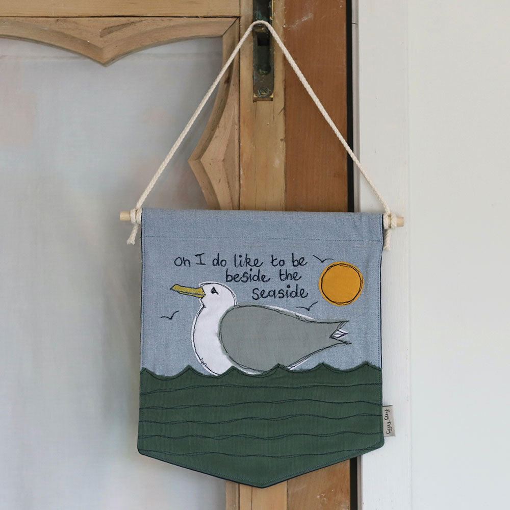 'I do like to be beside the seaside' embroidered Wall Hanging
