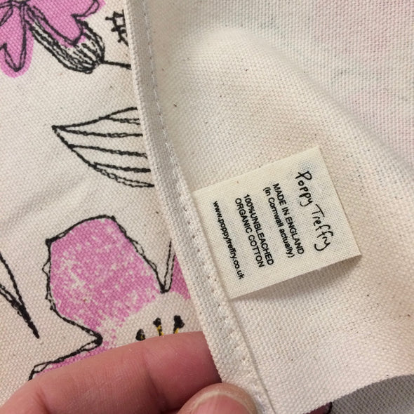 organic label on bee tea towel