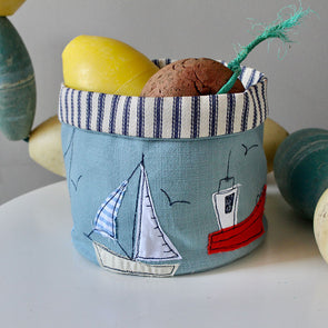 boats art pot with items inside