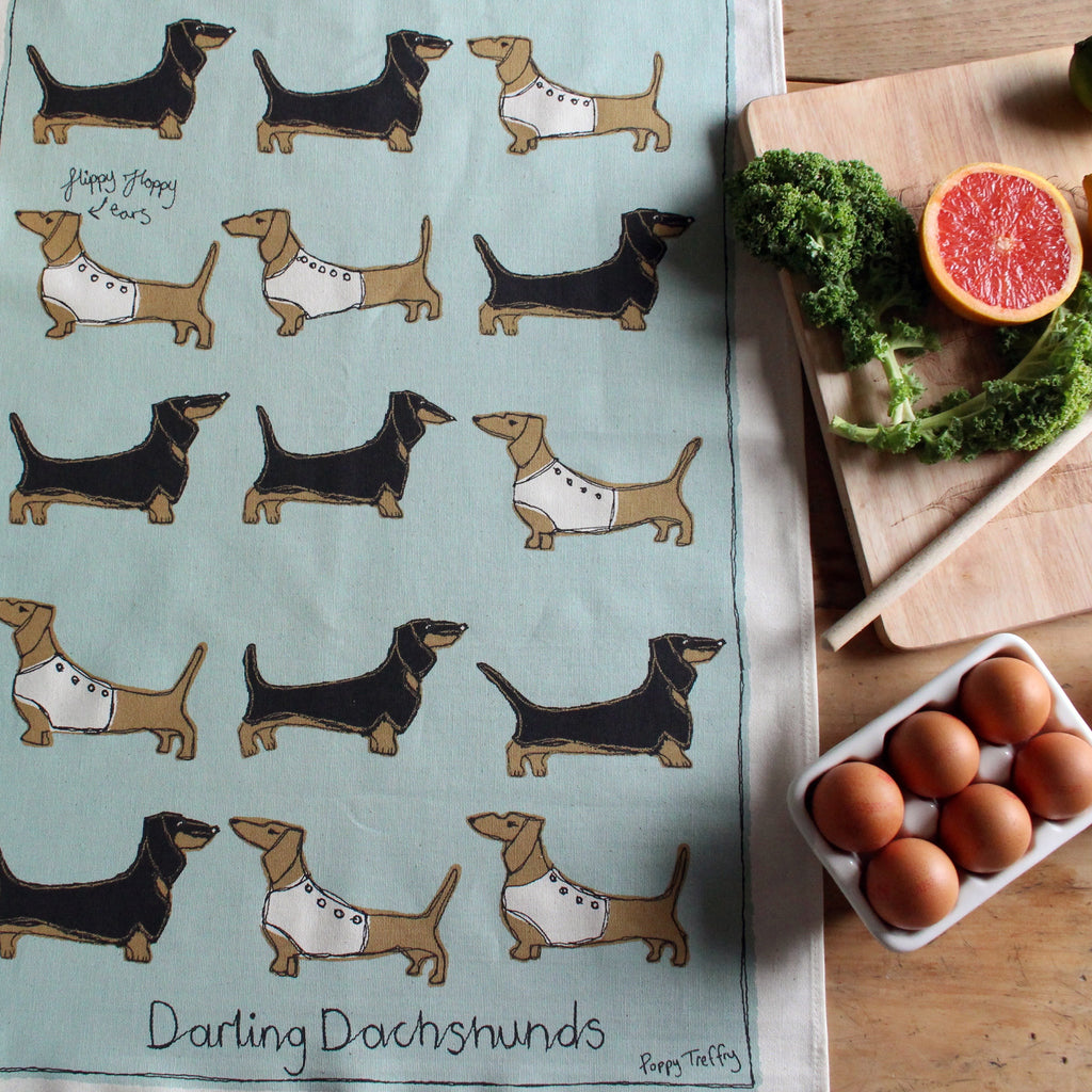 dachshunds tea towel by Poppy Treffry