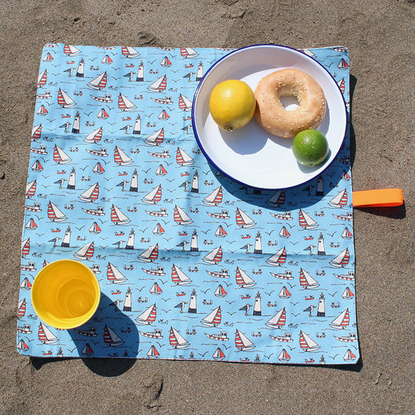 seaside picnic mat with food